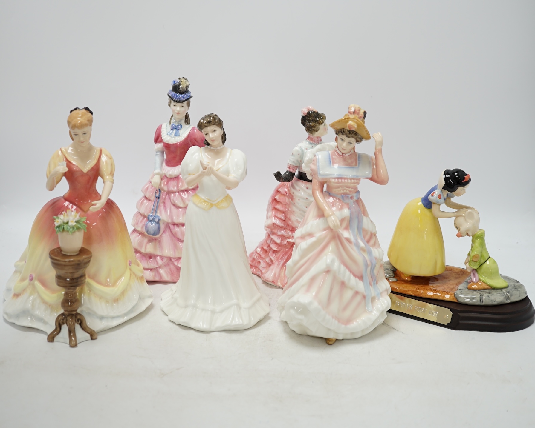 Five Royal Doulton figures including Diane, L’ambitieuse and Sharon, together with a Disney Showcase Collection figure, ‘Dopey’s first kiss’, all boxed. Condition - figures good, boxes poor to fair